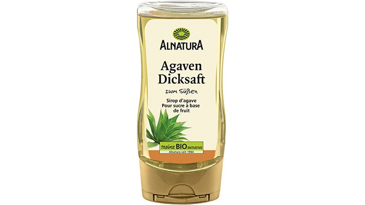 Gelbe Kunststoffflasche mit Alnatura Agaven-Dicksaft, Aufschrift „zum Süßen, meine BIO Initiative, Alnatura seit 1984“.