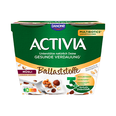 Grüner Becher mit weißem Schriftzug „ACTIVIA“, Text „Ballaststoffe“, „Müsli cremig lecker“ und Abbildung von Müsli mit Nüssen.