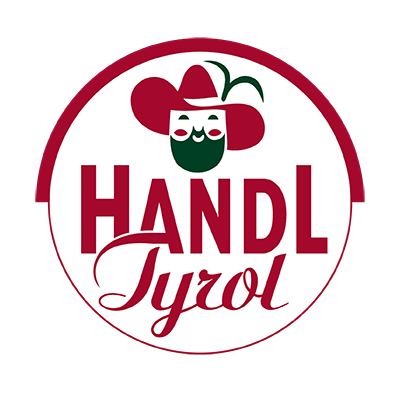 Rotes und grünes Logo mit der Aufschrift „HANDL Tyrol“, einer stilisierten Person und einem weißen Hintergrund.