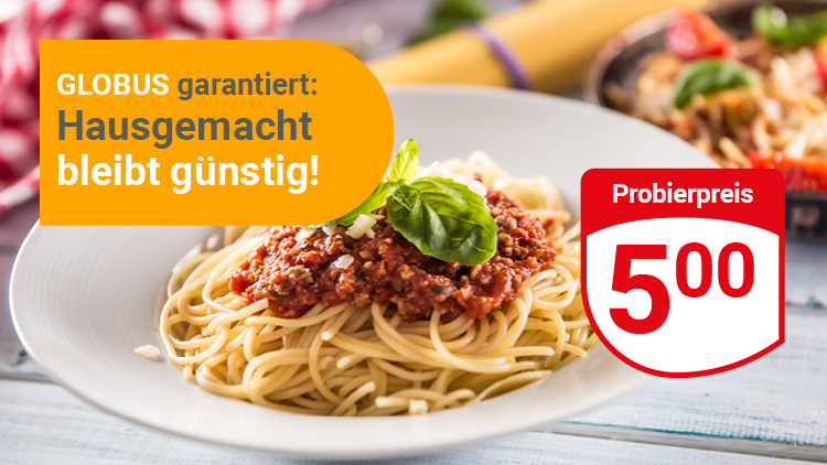 Ein Teller Spaghetti mit Tomatensoße und Basilikum, daneben Text: GLOBUS garantiert: Hausgemacht bleibt günstig, Probierpreis 5,00.