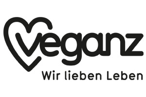 Schwarzes Logo „veganz“ mit herzförmigem V vor weißem Hintergrund, darunter der Text „Wir lieben Leben“.