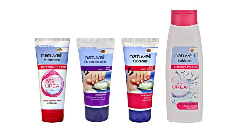 Fünf Pflegeprodukte der Marke „natuvell“ mit Urea: Handcreme, Schrundensalbe, Fußcreme und Bodylotion, jeweils mit farbigen Etiketten.