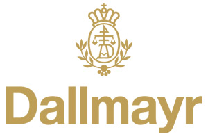 Goldenes Dallmayr-Logo mit Krone, Initialen „AD“ in Waage-Kreis und Lorbeerzweigen, darunter steht „Dallmayr“.