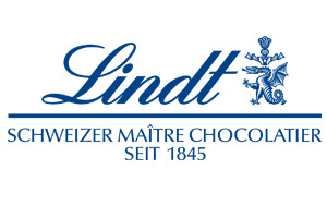 Blaues Logo mit dem Schriftzug Lindt, darunter Schweizer Maître Chocolatier seit 1845 und einem Drachenemblem rechts.