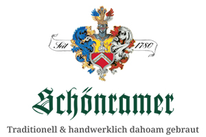 Wappen mit Helm und Verzierungen, darüber Schriftzug \