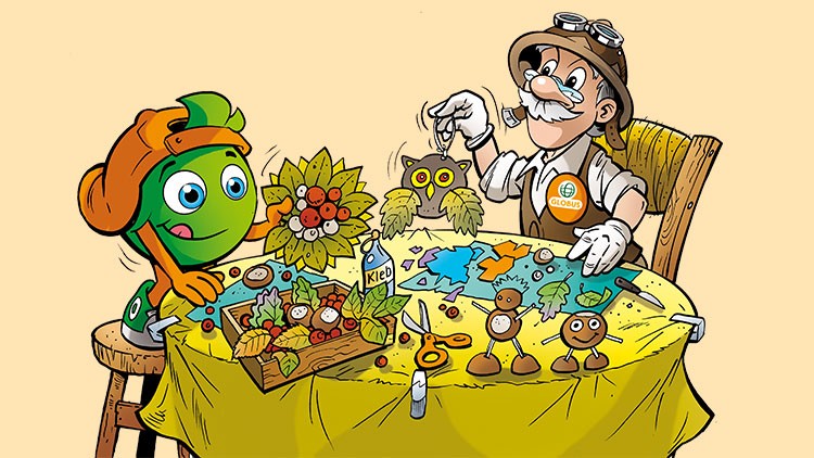 Globini und Professor Globus basteln herbstliche Dekorationen an einem gelb gedeckten Tisch mit Bastelmaterialien.