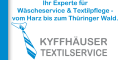 Blauer Hintergrund mit Krawattensymbol und Text: Ihr Experte für Wäscheservice & Textilpflege - vom Harz bis zum Thüringer Wald. KYFFHÄUSER TEXTILSERVICE.