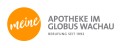 Orange Kreis mit weißem Schriftzug „meine“, daneben grauer Text „APOTHEKE IM GLOBUS WACHAU BERUFUNG SEIT 1992“.